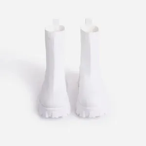 Front view of white breathable knit sock boots with chunky platform lug sole