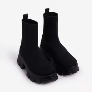 Detailed view of premium black breathable flyknit sock boots with chunky platform sole
