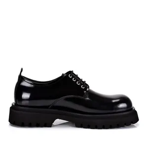 Side view of black polished leather derby shoes with chunky lug platform soles