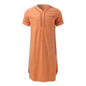 Detailed view of a men's coral cotton nightgown with short sleeves and black piping accents.