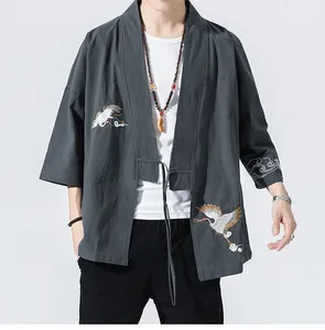 Detail view of crane embroidery on loose-fit grey Japanese style haori cardigan