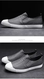Men's fashionable grey leather slip-on loafers with white ribbed toe cap for autumn style