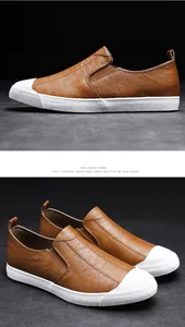 Close-up detail of brown men's casual leather loafers with white reinforced toe caps