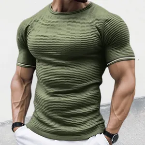 Detail of olive green textured knit t-shirt showcasing slim fit and ribbed fabric