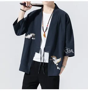 Men's navy blue kimono style cardigan featuring intricate white crane embroidery detail