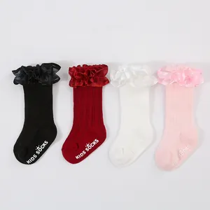 Detailed view of baby girl princess socks in four colors with ruffle lace cuffs