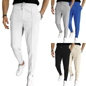 Close-up of men's waffle knit drawstring joggers in white, grey, blue, black, and khaki
