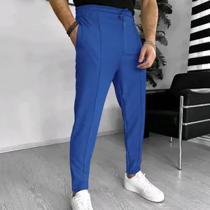 Detail view of men's bright blue waffle texture casual trousers with elastic drawstring waist