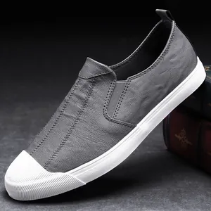 Men's grey leather slip-on loafers with white rubber sole for casual business wear