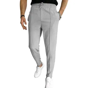 Detail shot of men's grey waffle knit jogger pants with adjustable drawstring waist