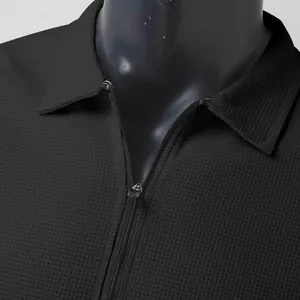 Close-up of black waffle knit texture on men's lapel zipper cardigan jacket