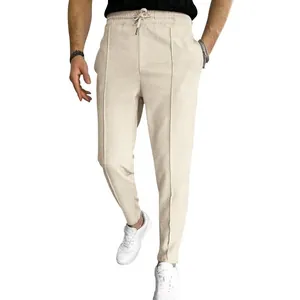 Close-up detail of mens beige waffle knit joggers with drawstring waist for casual daily wear