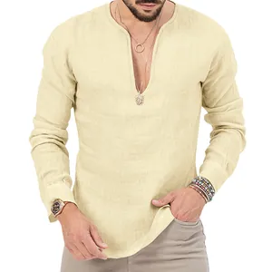 Detail of men's cream linen long sleeve shirt with deep V-neck and textured fabric.