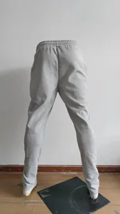 Rear view of grey waffle knit jogger pants for men featuring an elastic waistband