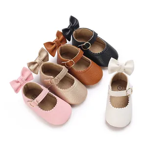 Detail of baby girl walking shoes in multiple colors with cute bow accents