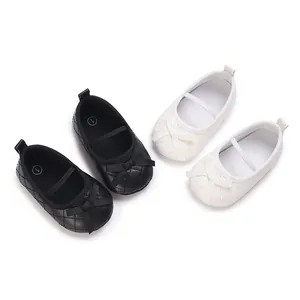 Adorable infant quilted ballet flats in black and white colors featuring delicate bow details