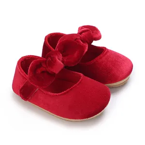 Red velvet baby girl princess shoes with large bow and soft sole for baptism events.