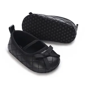 Classic black quilted baby girl flat shoes featuring a sweet bow and non-slip soles.