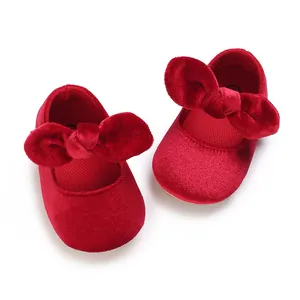 Soft red velvet baby girl princess shoes with large bow design for christening or baptism
