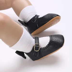 Close-up of black non-slip baby Mary Jane shoes with soft rubber soles for walking