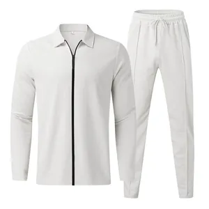 Close-up of men's white waffle knit tracksuit with zip-up polo top and joggers