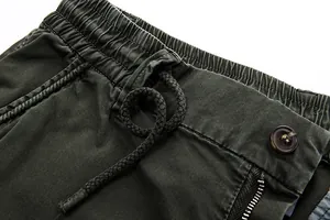 Close-up of men's cargo pants featuring elastic waistband and adjustable drawstring