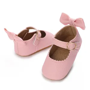 Detailed view of pink baby girl Mary Jane walking shoes with bow accent and buckle strap