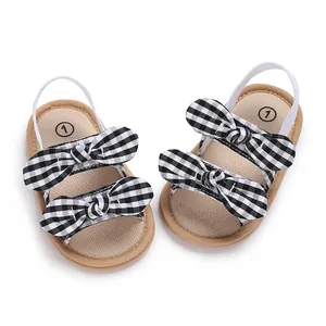 Sandalias de verano para bebé niña con lazos a cuadros blanco y negro y tira elástica