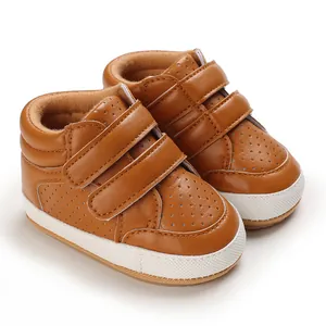 Detailed view of brown leather baby toddler shoes with velcro straps and breathable holes