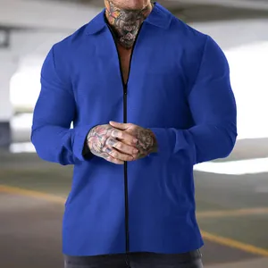 Close-up of men's blue waffle knit zip-up jacket with turnover collar