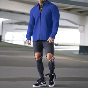Men's blue waffle knit jacket with zipper and collar in an urban setting