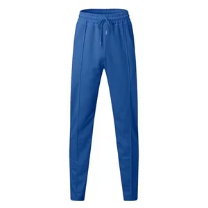 Detailed view of men's blue waffle knit slim fit joggers featuring a drawstring elastic waist