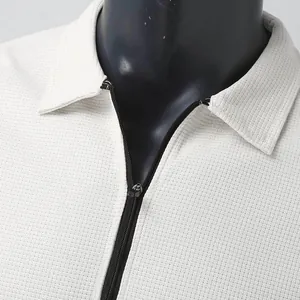 Detail of waffle knit fabric and zipper on men's casual lapel cardigan jacket