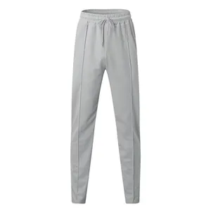 Close-up detail of grey waffle knit joggers with drawstring and center seams
