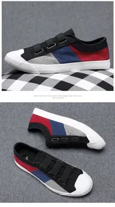 Detailansicht der farbblockierten Herren-Segeltuchschuhe mit Klettverschlussgurten.