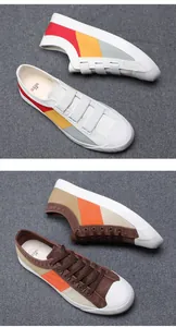 Detailansicht von stilvollen farbblock herren slip-on sneakern und klassischen segeltuchschuhen