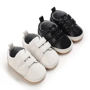 Comfortable baby boys' walking shoes in black and white with non-slip rubber soles