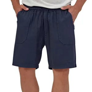 Detailed front view of men's navy blue cotton linen drawstring shorts on a model.