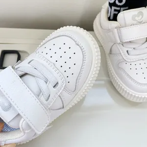 Casual white faux leather toddler walking shoes with velcro straps and breathable perforated toe