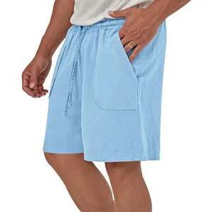 Detail of men's light blue cotton linen shorts with drawstring waist and pockets