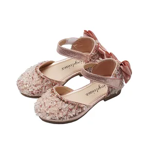 Elegant pink girls closed toe rhinestone dress shoes with silk bow detail for performance
