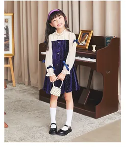 Elegant black patent leather girls school shoes featuring a sweet pearl buckle design detail.