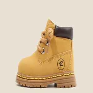 Side view of toddler mustard yellow Martin boots featuring thick lug soles and brown collars