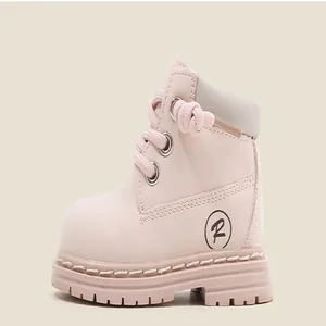 Side view detail of pink toddler Martin boots featuring soft upper and non-slip sole