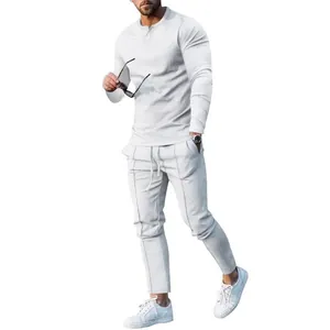 Full-length view of a casual men's light grey long-sleeve T-shirt and pants set.