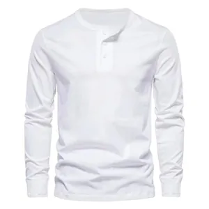 Detailed view of a white long-sleeved Henley shirt with a classic buttoned placket