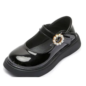 Glossy black patent leather girls' Mary Jane shoes featuring an elegant pearl buckle detail