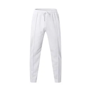 Detailed view of white men's sports joggers with elastic waistband and drawstring feature
