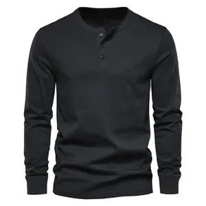 Front detail view of a black long-sleeved Henley shirt with a classic three-button collar design