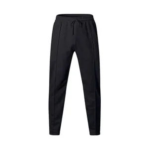 Close-up front view of men's casual black sports pants with a drawstring elastic waist